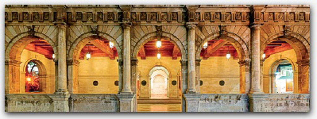 History of the Island a stone building with columns and a light